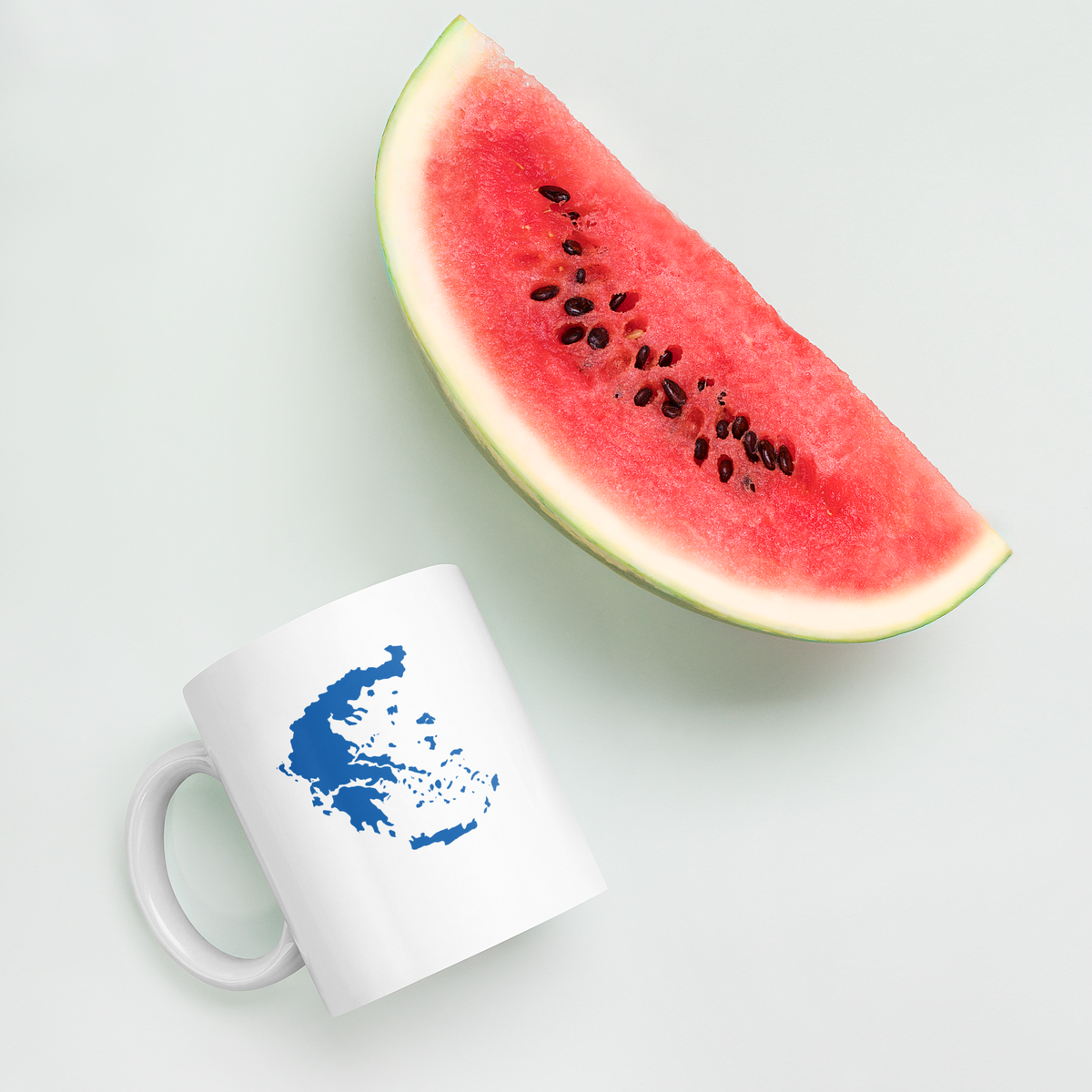 White glossy mug featuring a blue and white map of Greece — additional product photo.